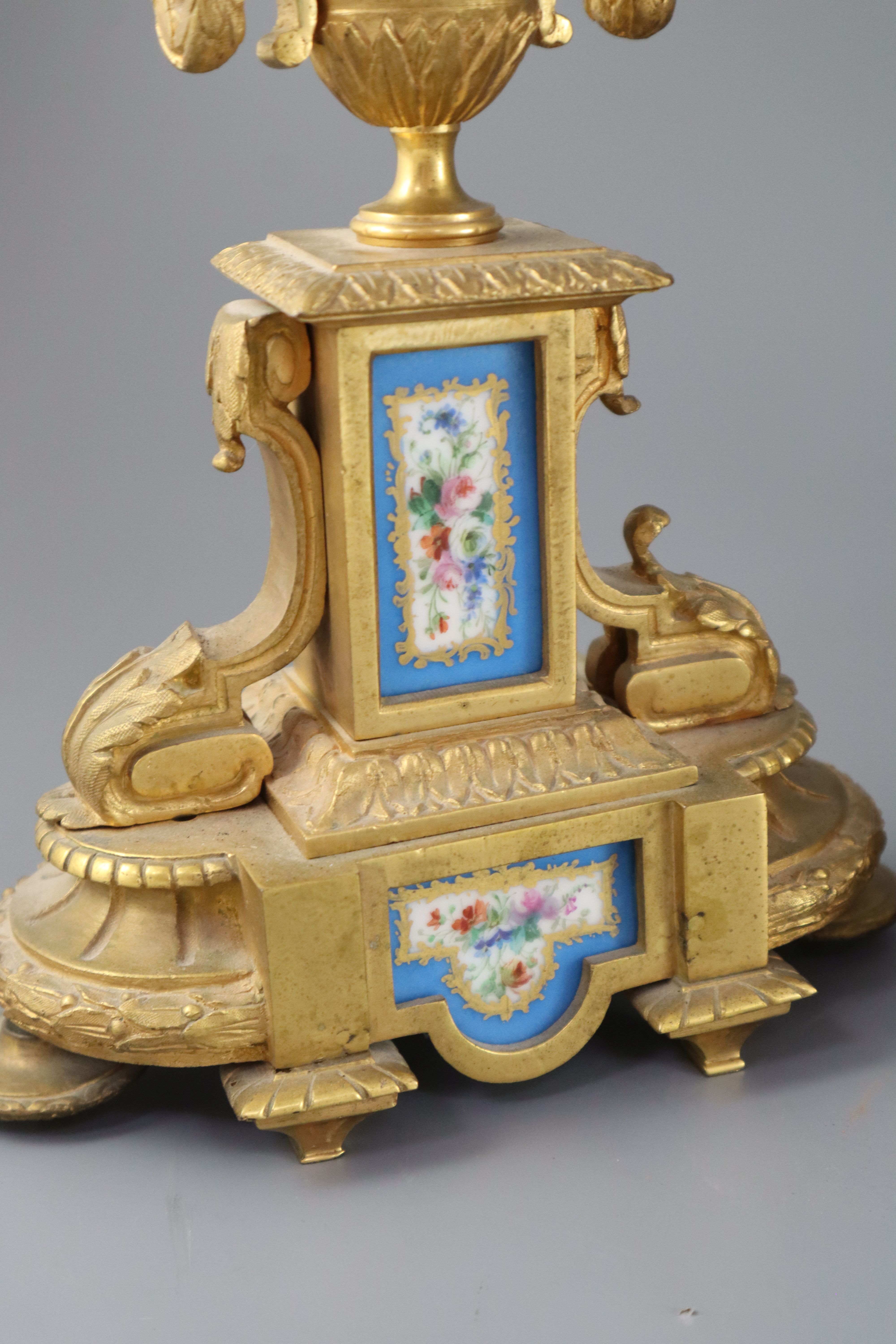 A 19th century Louis XVI style ormolu and Sevres style porcelain clock garniture, height 16.5in.